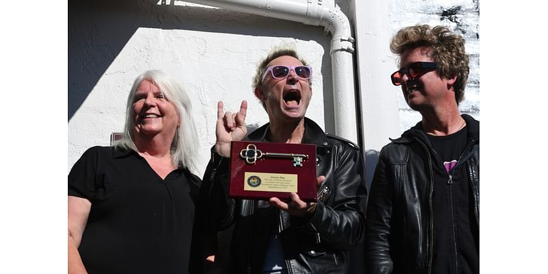 Green Day receives key to Bay Area city, autographs mural at 7