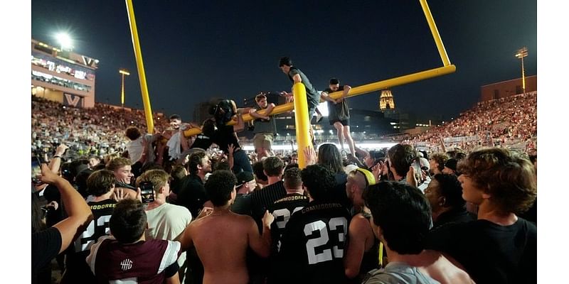 Vanderbilt Commodores celebrate historic win by tossing goal post into river