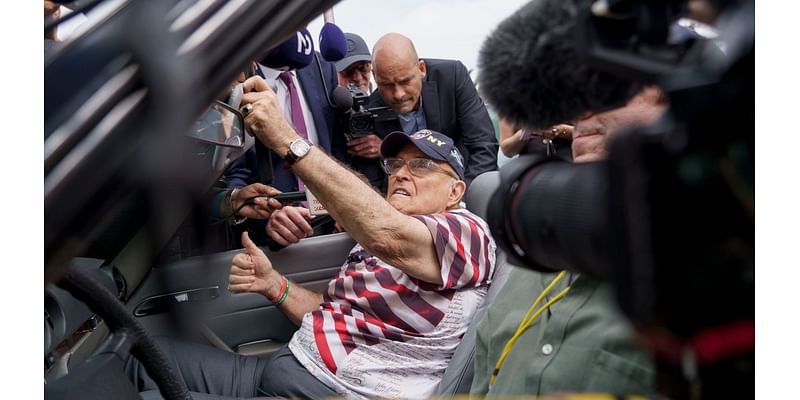 Rudy Giuliani shows up to vote in the Mercedes he was ordered to surrender