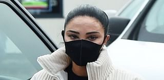 Tulisa hides her face behind surgical mask after revealing the shocking results of swollen TATTOOED lips ahead of I'm A Celeb stint