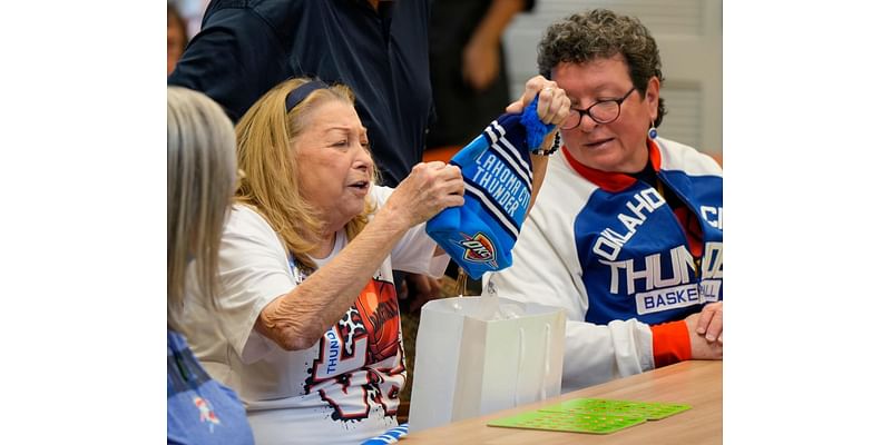 See photos as Thunder Player Ajay Mitchell calls Thanksgiving Bingo for seniors