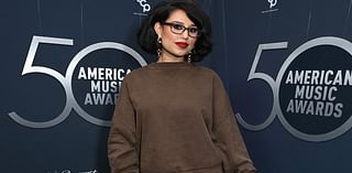 Worst dressed! Raye dresses down in baggy sweater and bold mini skirt alongside Sophia Culpo as they lead fashion fails at the American Music Awards 50th Special