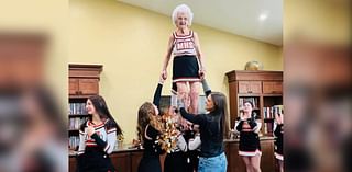 Former cheerleader puts on her uniform at Merrill High School