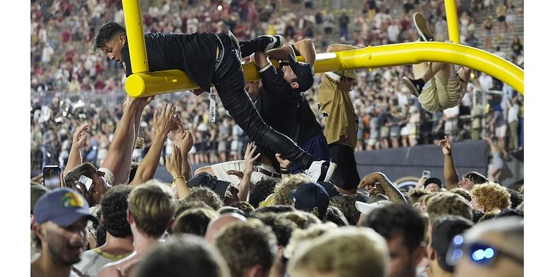 Vanderbilt and Arkansas fined for fans storming the field after upset wins