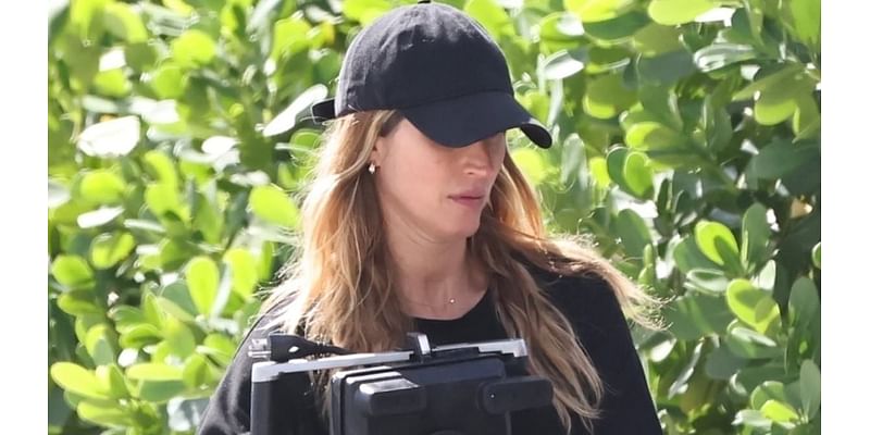 Pregnant Gisele Bundchen surfaces solo amid claims she is happy with 'new life' after Tom Brady divorce