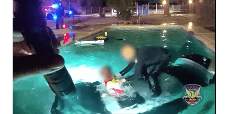 VIDEO: Officer jumps into action to save man after car plunges into pool