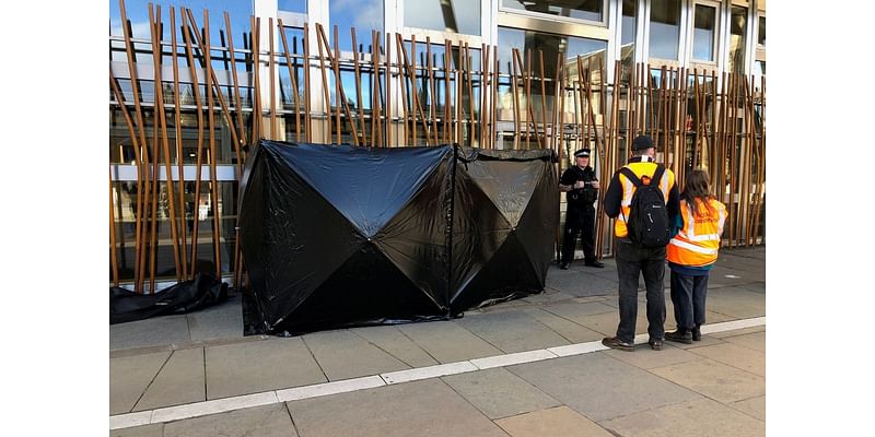 Climate activists clamp themselves to Scottish Parliament building