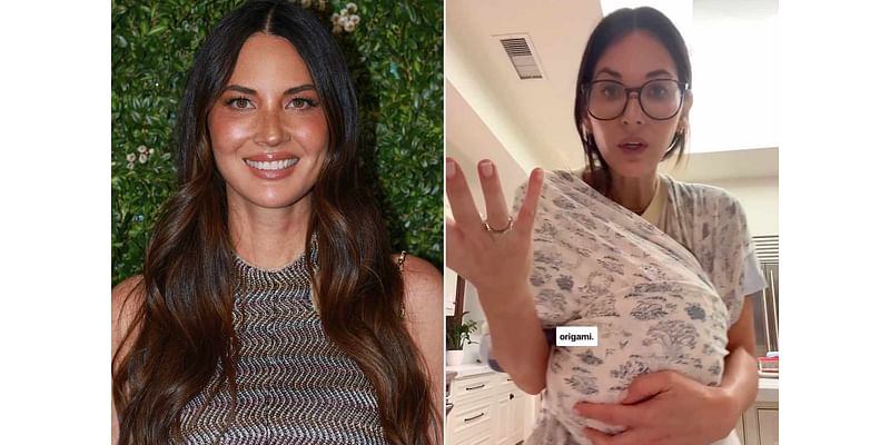 Olivia Munn Jokes That Figuring Out How to Use a Baby Wrap Is 'More Difficult Than Origami': 'I Don't Know How to Do This'