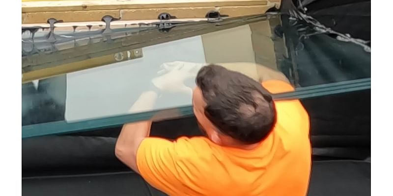 Shocking moment pond expert is nearly beheaded when 28-stone glass panel falls on his neck