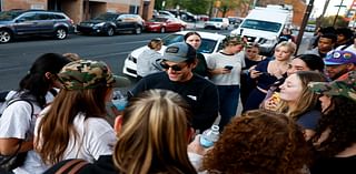 Actor Paul Rudd hands out water to voters at Pa. universities