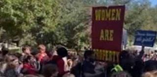 Protesters hold up disturbing 'women are property' signs at Texas college campus