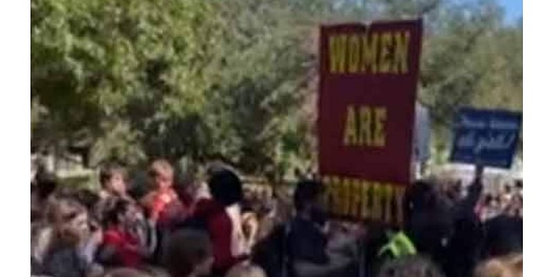 Protesters hold up disturbing 'women are property' signs at Texas college campus