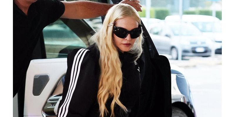 Madonna, 66, puts on a VERY leggy display in thigh high socks and black mini skirt as she departs Milan after debuting her new super-smooth look