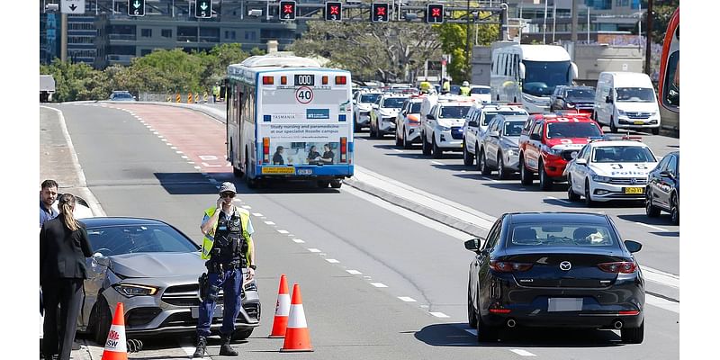 Motorcyclist arrested on Sydney Harbour Bridge after fatal crash allegedly hit a cop while speeding away from police