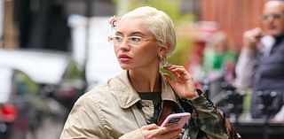 Iris Law cuts a stylish figure in a tie-dye trench coat and glasses as she arrives at London studio for mystery project