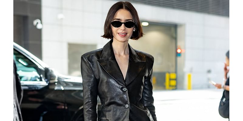 Lily Collins cuts a chic figure in a black leather blazer and flared trousers as she steps out in New York City