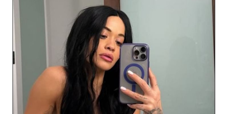 Rita Ora tries out new 'goth' look as she poses topless in a long black wig for sizzling snap