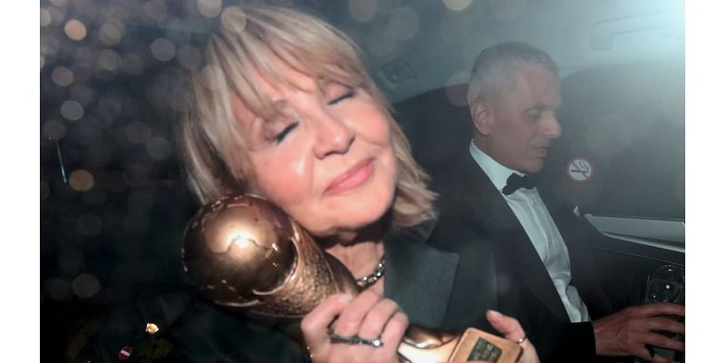 Lulu, 75, looks worse for wear posing with her National Film Award as she joins boozy Hollyoaks star Terri Dwyer heading home from wild afterparty